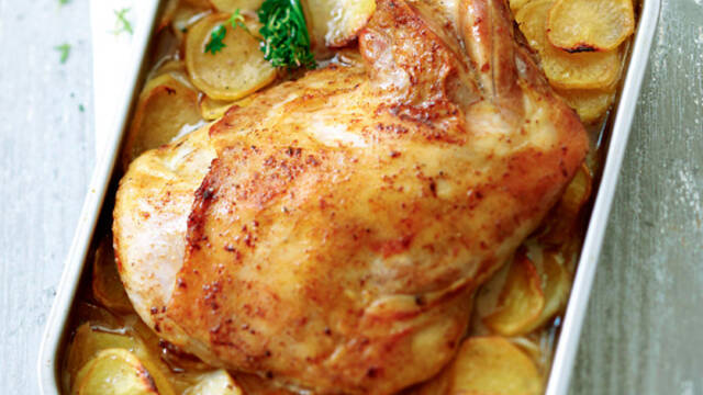 Catalan roasted gigot of lamb with rosemary and sweet garlic sauce 